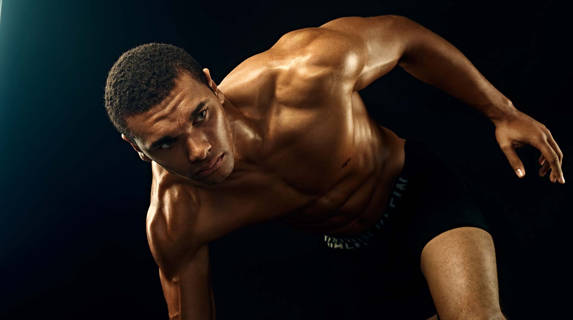 Color photo of athlete preparing to run. Photographed in Studio in Los Angeles