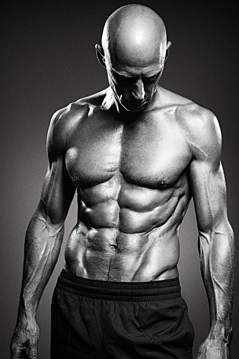 Portrait of bodybuilder in Hollywood. Black and white photo with high contrast lighting