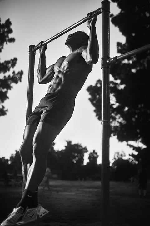 Action photo of man doing pull-ups in North Hollywood Park